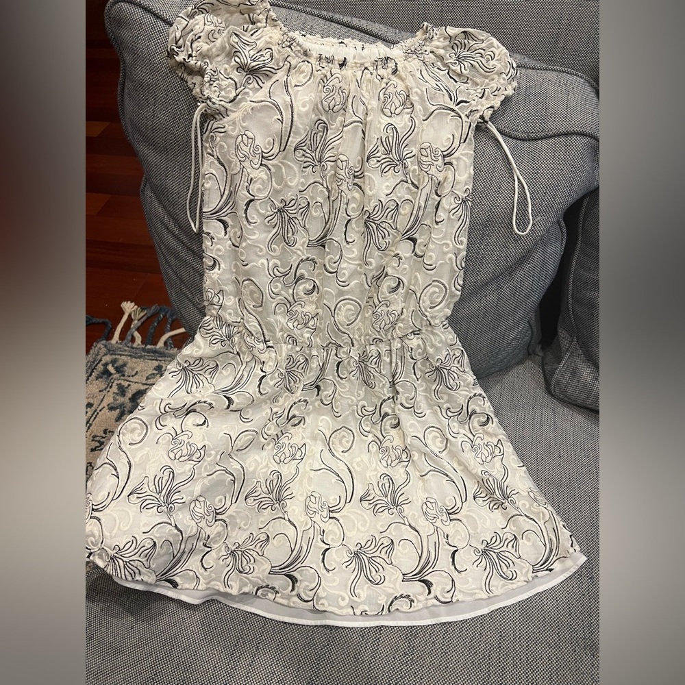 A lovely, classy, off shoulder, mini summer dress.